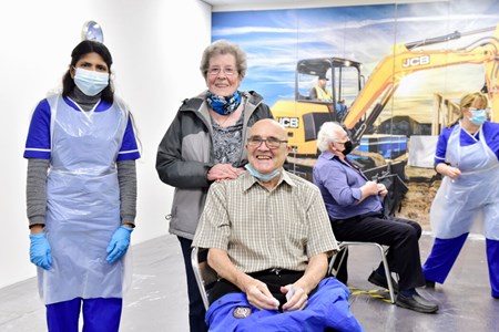 Jim and Joan Walker, of Stoke-on-Trent with Dr Deepa Muthumanickam after their injections. 