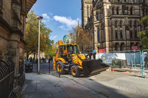 3CX PLUS working on an inner city site with its loader bucket