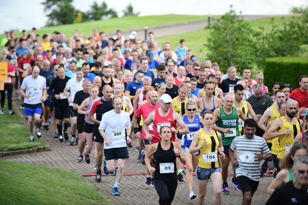 Runners limber up for return of popular JCB charity road race